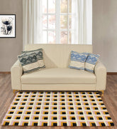 Modern grid rug with bold black squares on cream background